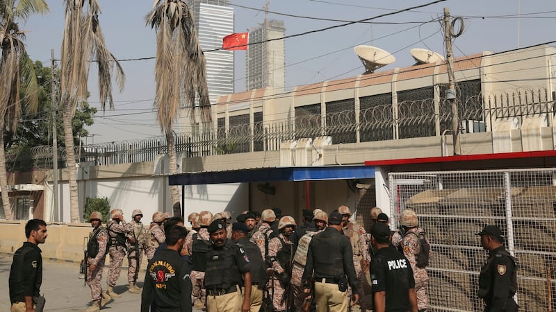 Pakistani security personnel move in the compound of Chinese Consulate in Karachi, Pakistan, Friday. Photograph: AP Photo/Shakil Adil