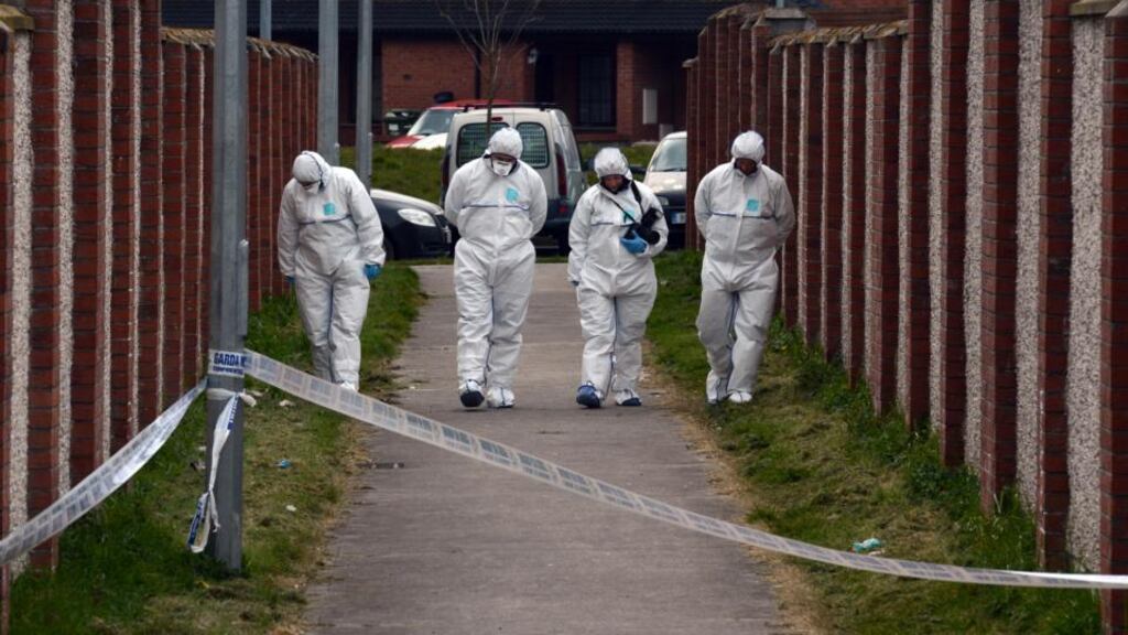 Forensic  gardaí searching for evidence at Coneyboro Estate in Athy where a man was shot dead on Saturday night. Photograph: Cyril Byrne