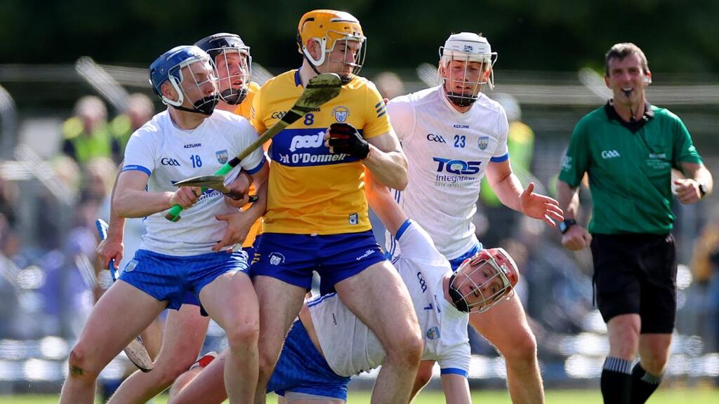 Waterford’s Kieran Bennett and Calum Lyons tackle David Fitzgerald of Clare during the Munster SHC round-robin game at Cusack Park in  Ennis. Photograph: James Crombie/Inpho