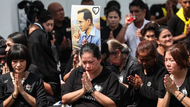 Thai mourners pay their respects during the royal cremation ceremony on Thursday. Photograph: Diego Azubel/EPA