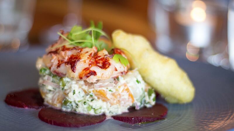 Poached lobster tail on crab salad with couregtte fritter, on the summer lobster menu at Suesey Street