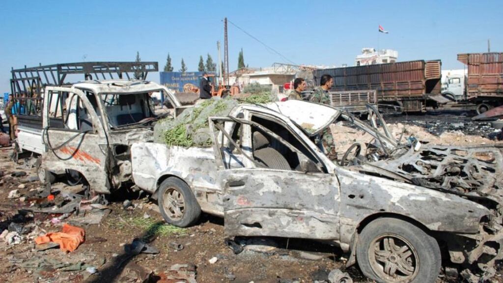 The aftermath of a suicide truck bomb at the eastern entrance of Hama city. The truck was packed with 1.5 tonnes of explosives which killed 30 people and wounded dozens. Photograph: Reuters/Sana/Handout