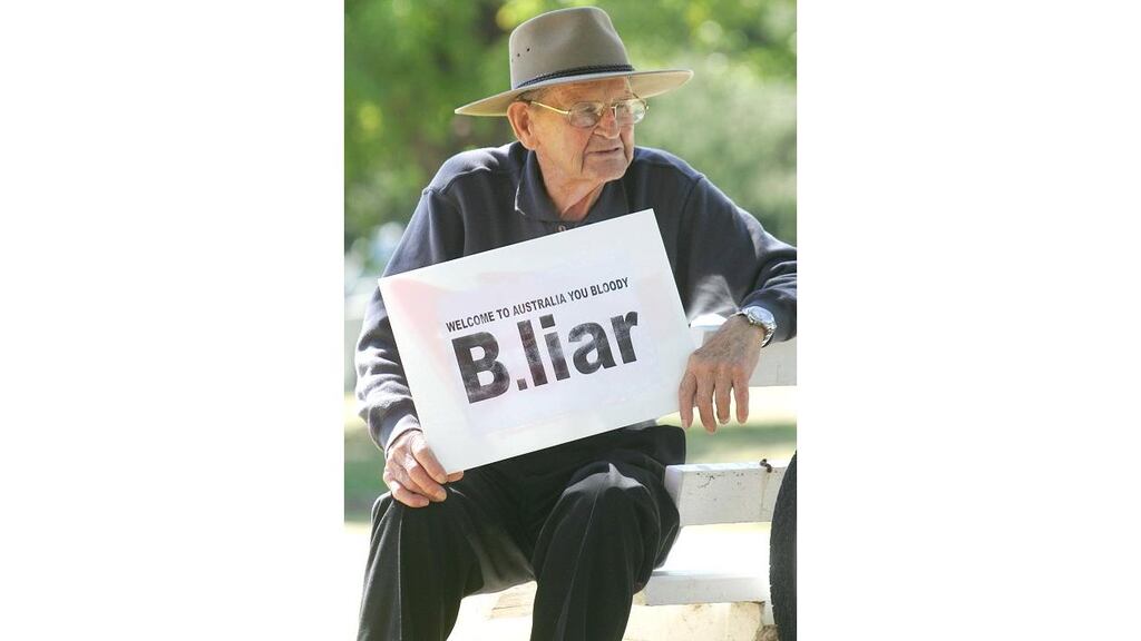 An anti-Blairite in Canberra yesterday during a protest which took place as the prime minister addressed Australian politicians inside Parliament House.