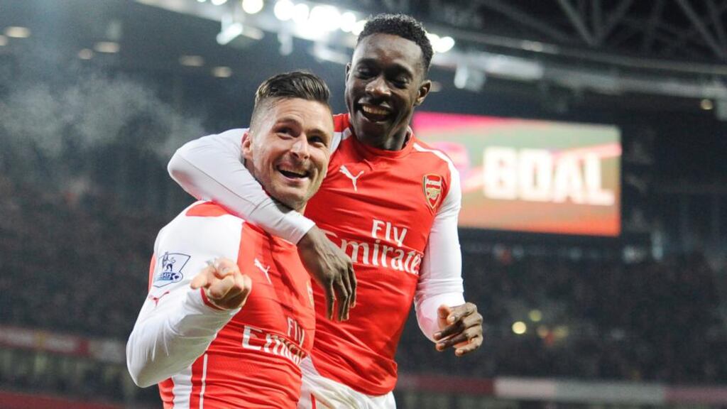 Arsenal striker Olivier Giroud (left) celebrates with Danny Welbeck after scoring against Newcastle at The Emirates Stadium. Photograph: Facundo Arrizabalaga / EPA