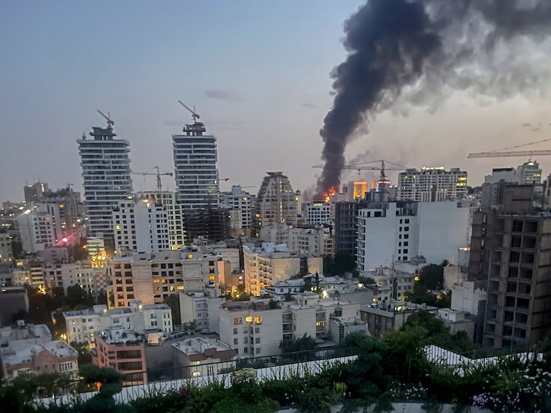 Smoke rises from the rubble of an Iranian state media building in Tehran on Monday. Photograph: AFP via Getty Images