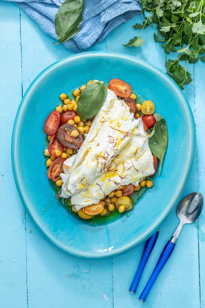 Baked hake with saffron, chickpeas and rainbow tomatoes. Photograph: Harry Weir Photography