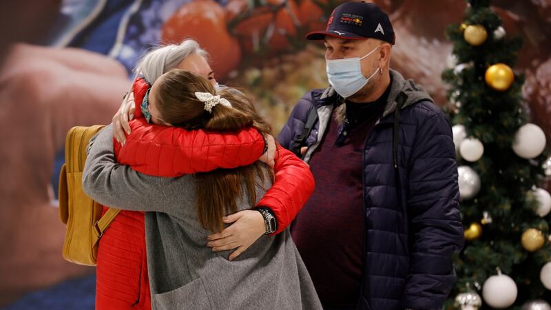 Erika Golubovskyte from Kerry greeting her parents Birute and Vitalijus on their arrival from Lithuania to Dublin Airport for Christmas. Photograph: Alan Betson / The Irish Times
