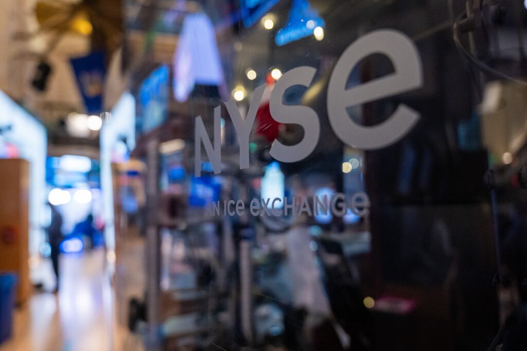 Traders work on the floor of the New York Stock Exchange (NYSE). Wall Street’s main indexes slipped in early trading, weighed down by technology stocks after a batch of upbeat economic data stoked uncertainty among investors about the pace of monetary policy easing that the Federal Reserve could pursue this year. Photograph: Spencer Platt/Getty Images