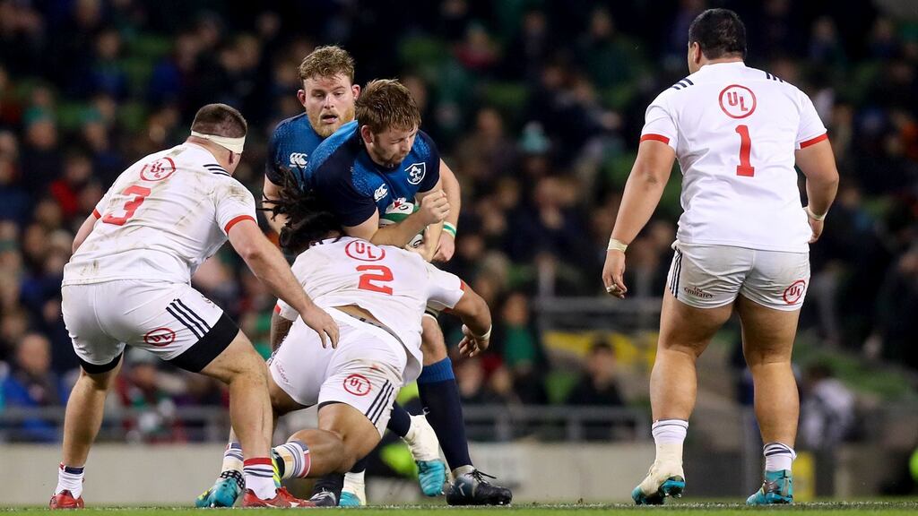 Ireland’s Iain Henderson is tackled by Joe Taufete’e of the USA resulting in the USA player requiring prolonged treatment on the pitch. Photograph: Tommy Dickson
