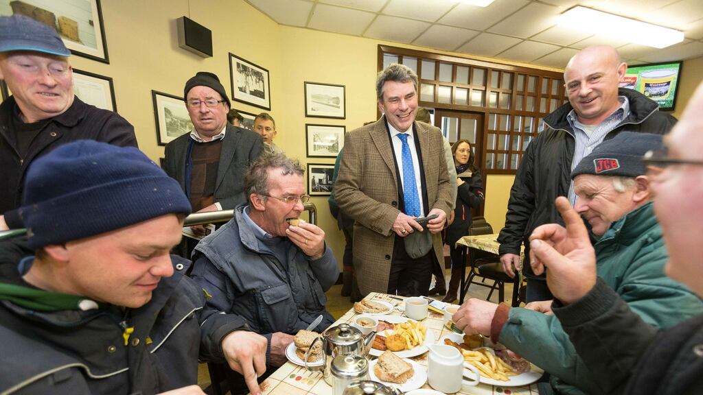 Independent general election candidate Dr Michael Harty (standing, centre) chatting to Kinvara men Patrick Quinn, Michael O’Loughlin, Michael O’Loughlin jnr and Patrick O’Loughlin during a visit to Ennis Mart. Photograph: Eamon Ward