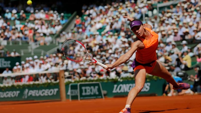Simona Halep of Romania returns the ball to Maria Sharapova of Russia during the women’s French Open final at the Roland Garros stadium in Paris . Photograph: Stephane Mahe / Reuters