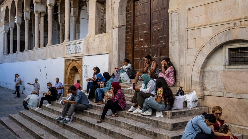 People on the steps of the Zaytuna mosque in the historic Medina quarter of Tunis. Tunisia was the birthplace of the pro-democracy uprisings that swept the Arab world in 2011, but now looks to many like confirmation of a failed promise. Photograph: Ivor Prickett/New York Times