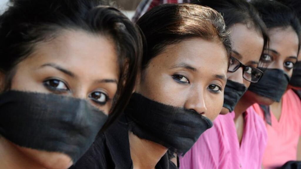 Members of the All Assam Photojournalist Association wear black sashes around their mouths during a protest against the rape of a photo journalist by five men inside an abandoned textile mill in Mumbai, in the northeastern Indian city of Guwahati.
