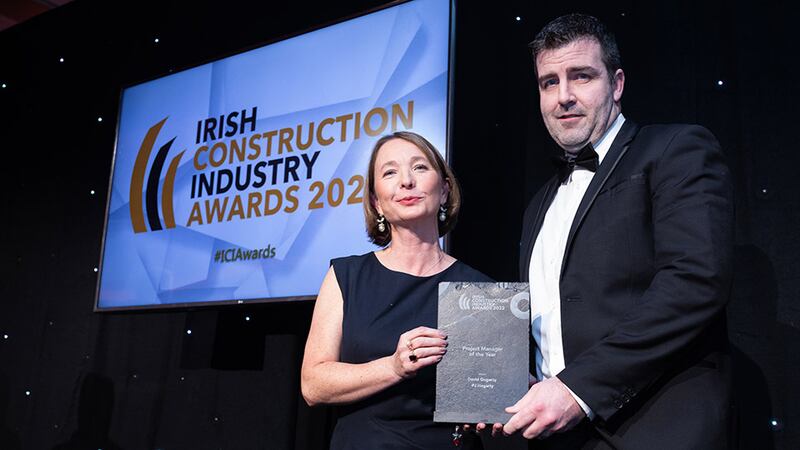 Collette Burns, Awards Judge, presents the project manager of the Year award to David Gogarty, PJ Hegarty.