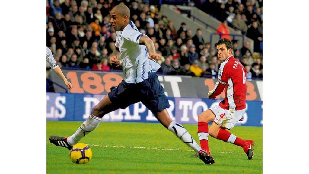 Arsenal's Cesc Fabregas scores the first goal against Bolton Wanderers after a neat interchange with Eduardo in the 28th minute during yesterday's Premier League match in Bolton.