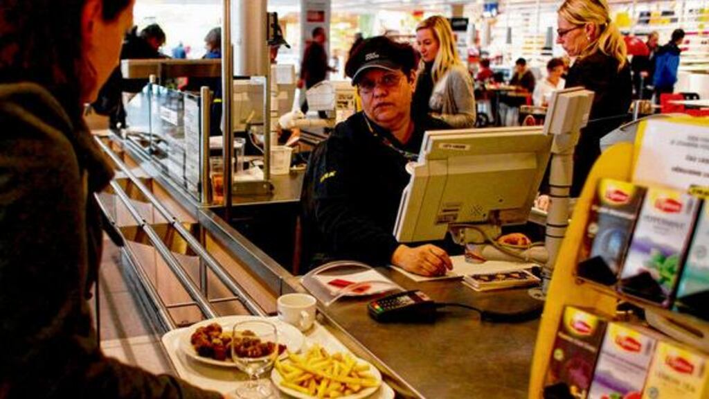 A customer buys lunch at the Ikea cafeteria in Prague. Authorities in the Czech Republic discovered horse meat in a batch of Ikea's meatballs. photograph: reuters