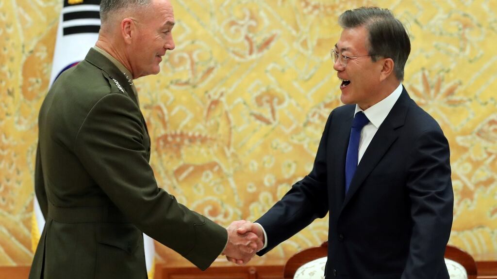 South Korean president Moon Jae-in shakes hands with US chairman of the joint chiefs of staff Gen Joseph Dunford in Seoul on August 14th. Photograph: Bae Jae-man/Yonhap