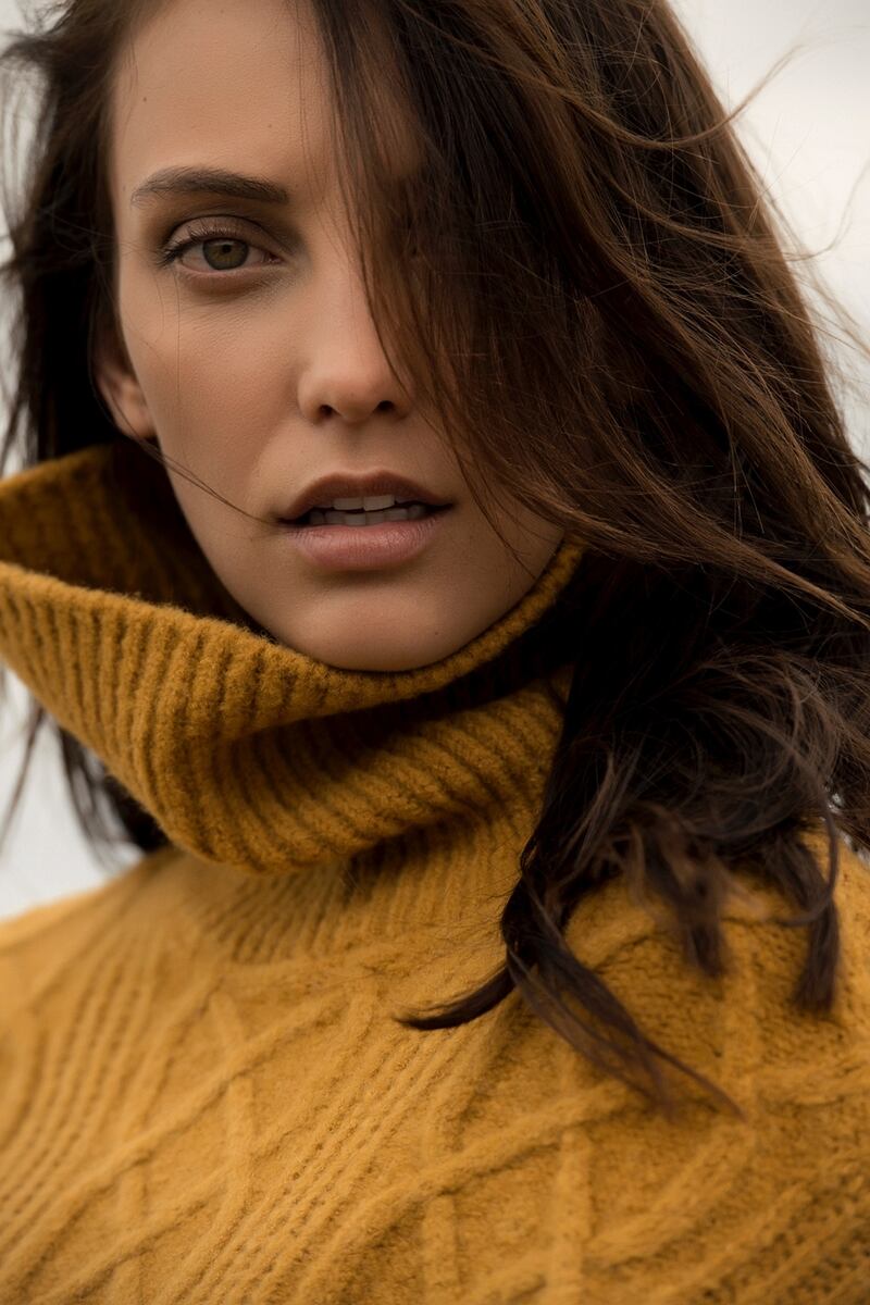 Bell sleeve gold sweater €59.95, brown midi skirt €69.95