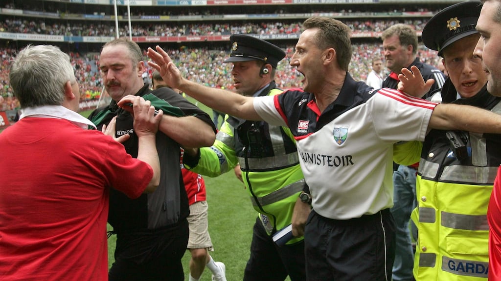 Louth manager Peter Fitzpatrick appeals to supporters to leave the pitch as they approach referee Martin Sludden following the 2010 Leinster senior football championship final. Photo: Donall Farmer/Inpho