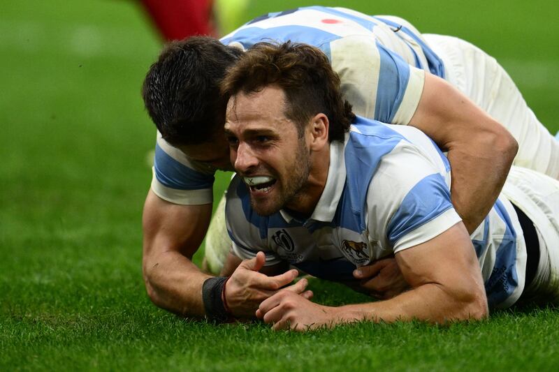 Argentina's left wing Mateo Carreras celebrates with Nicolas Sanchez after the latter scored a try against Wales. Photograph: Christophe Simon/AFP/Getty Images