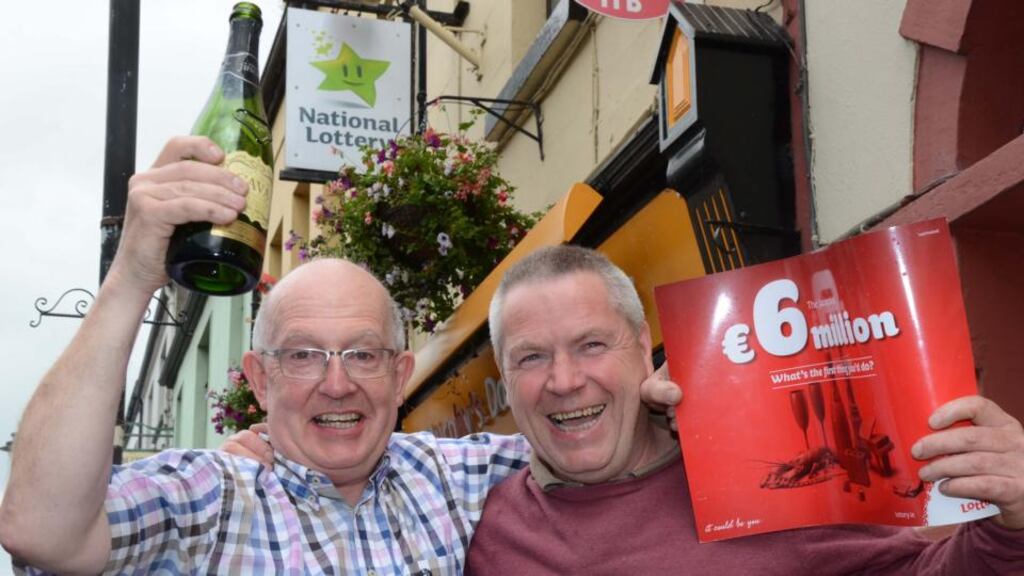 Lotto winner Ger Murphy (right) with his brother-in-law Martin Murphy, who sold him his €6 million-winning ticket at the Day Today store on Ballinrobe’s Main Street. Photograph: Paul Mealey