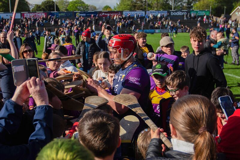 Wexford's Lee Chin signs hurls for young fans after the game against Galway in May. Photograph: Leah Scholes/Inpho