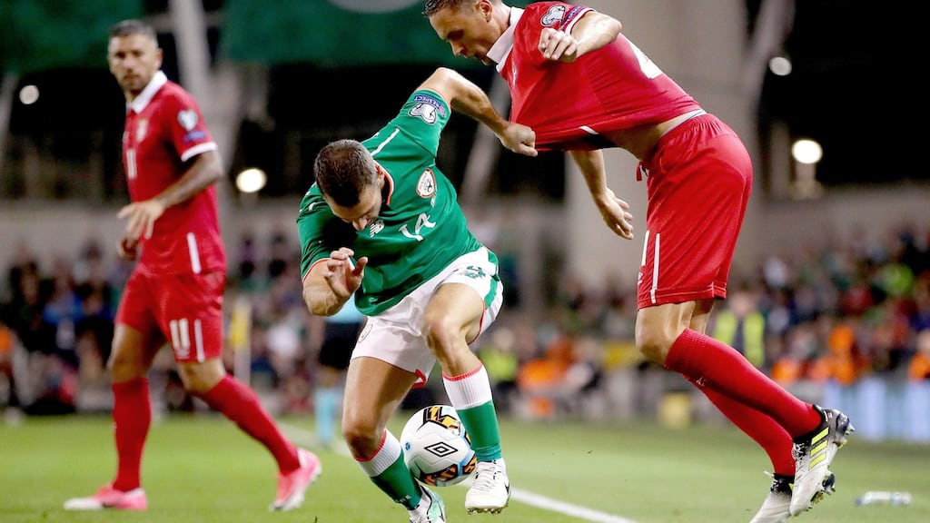 Wes Hoolahan tries to hold off Nemanja Matic during Ireland’s narrow defeat to Serbia. Photograph: James Crombie/Inpho