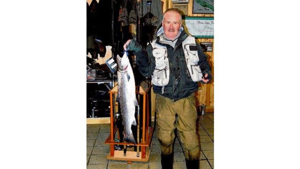 John O'Neill with his 4.8kg (10.5lb) salmon from The Meadow on the Drowes River last Wednesday. Below hisDrowes Sunset Tube fly