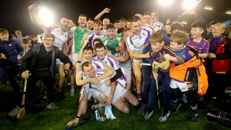 Kilmacud Crokes players and supporters celebrate with the trophy after their win over Na Fianna in the Dublin SHC Final at Parnell Park. Photograph: Ryan Byrne/Inpho
