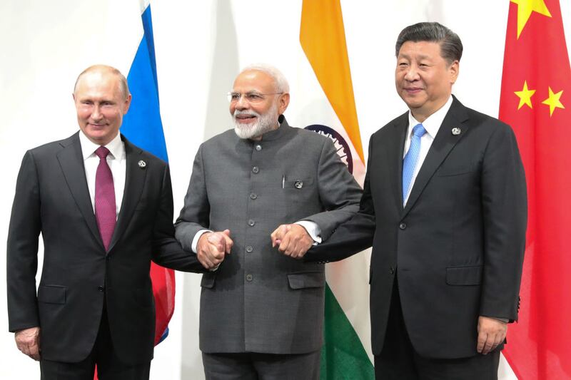 Russian president Vladimir Putin, Indian prime minister Narendra Modi and Chinese president Xi Jinping hold a meeting on the sidelines of a G20 summit in 2019. Photograph: Mikhail Klimentyev/Sputnik/AFP via Getty Images