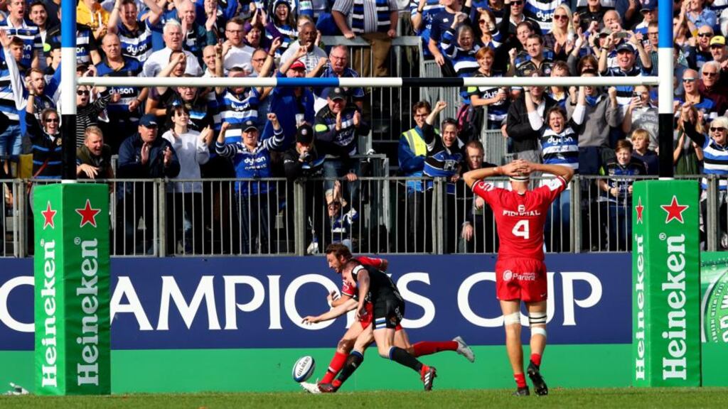Bath’s Freddie Burns fails to ground the ball to score a try late in the game as he is dispossessed by Maxime Médard of Toulouse during the Heineken Champions Cup game at the Recreation Ground. Photograph: James Crombie/Inpho