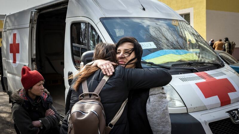 Part of a steady stream of people who fled the fighting in the frontline suburb of Irpin arrive at an aid station in Kyiv. Photograph: Ivor Prickett/New York Times