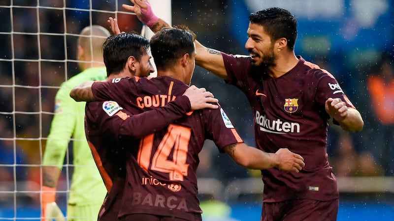 Lionel Messi celebrates with Philippe Coutinho and Luis Suarez at the Riazor stadium in Coruna. Photograph: Getty Images