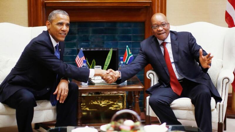 President Barack Obama  shakes hands with South Africa’s president Jacob Zuma during their meeting at the Union Buildings in Pretoria, today. Photograph: Reuters