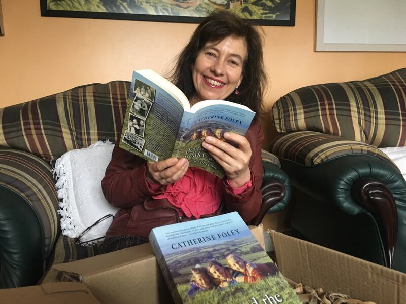 Catherine Foley with her new book