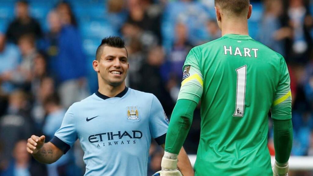 Manchester City’s Sergio Agüero celebrates with goalkeeper Joe Hart after their 4-1 Premier League win over Tottenham Hotspur at the Etihad Stadium. Photograph: Phil Noble / Reuters