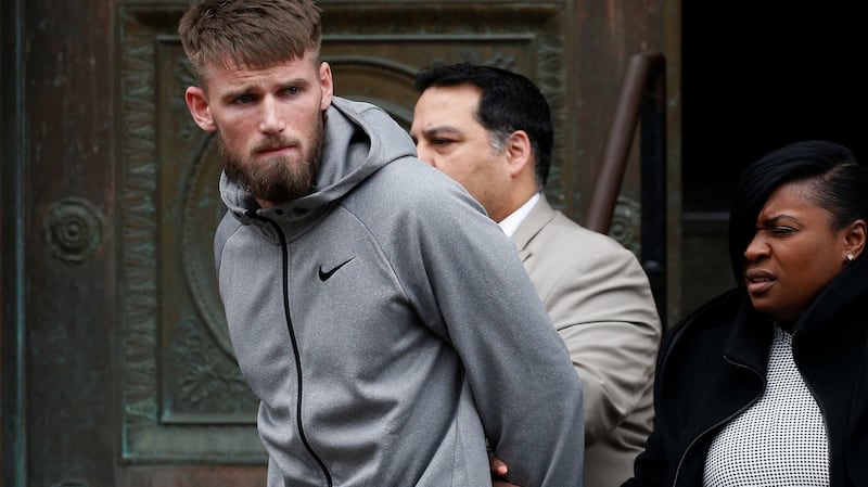 MMA fighter Cian Cowley walks out of the 78th police precinct after charges were laid against him. Photograph: Brendan McDermid/Reuters