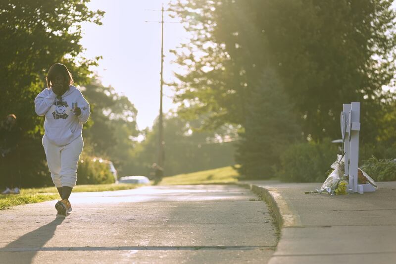 Hally Marshall walks away after praying at a memorial at Annunciation Catholic Church after Wednesday’s shooting in Minneapolis. Photograph: Abbie Parr/AP