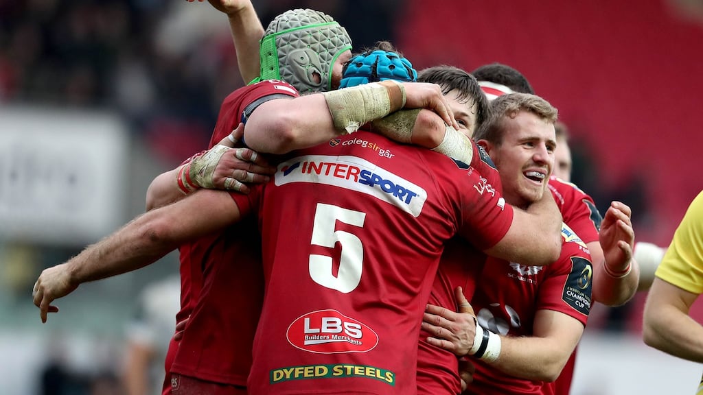 Scarlets players celebrate at the final whistle after their Champions Cup win over Toulon at Parc y Scarlets in Llanelli. Photograph: Dan Sheridan/Inpho