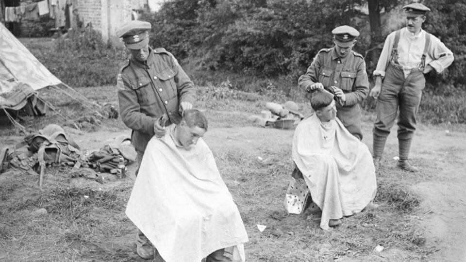 Even in the midst of all the carnage the ordinary mundanities of everyday life were carried on, such as getting a hair cut. Here the barbers of the 2nd Leinsters are hard at work in their camp. (Courtesy of the Imperial War Museum, Q 5850)