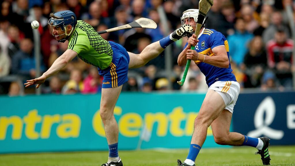 Tipperary’s Patrick ‘Bonner’ Maher scores his side’s third goal despite the efforts of Clare goalkeeper Donal Tuohy. Photograph: James Crombie/Inpho