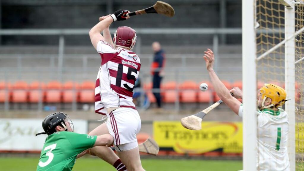 Slaughtneil’s Brian Cassidy in action against Ballygalget’s Eoin Clarke and goalkeeper Jamie Crowe during the AIB Ulster Senior Hurling Club Championship Final at the Athletic Grounds in Armagh. Photograph: Declan Roughan/Inpho