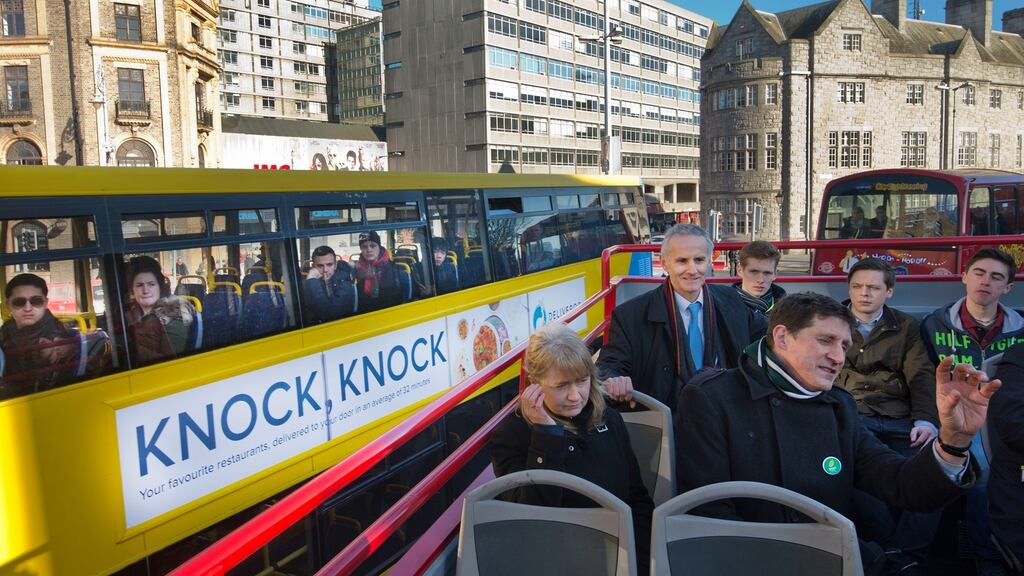 High and mighty: Caroline Conroy, Ciaran Cuffe and Green party leader Eamon Ryan outline their transport plans for Dublin on an open-top bus, which was 40 minutes late. Photograph: Brenda Fitzsimons
