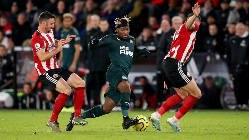 Ireland’s Enda Stevens (L) and John Egan chellenge Newcastle’s  Allan Saint Maximin. Photograph:  Alex Livesey/Getty