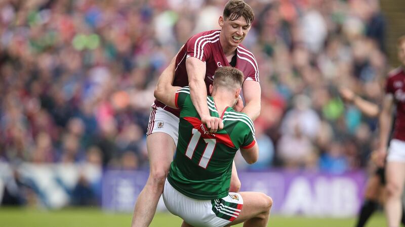 Tempers flare between Mayo’s Aidan O’Shea and Tom Flynn. Photograph: Cathal Noonan/Inpho