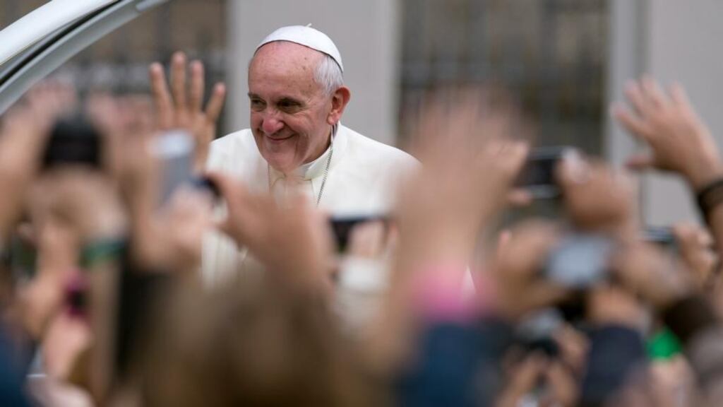 Pope Francis waves to the crowd while riding in the Popemobile yesterday in Rio de Janeiro, Brazil. Photograph: Buda Mendes/Getty Images
