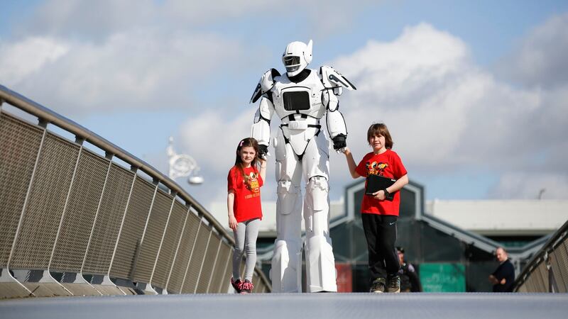 At the launch of CoderDojo Coolest Projects Awards 2016 at CHQ in Dublin were young coders Lexi Schoener (8) from Monkstown, Dublin and Jasper Brezina-Conniffe (11) from Wicklow with Lightron the robot. Photograph: Conor McCabe