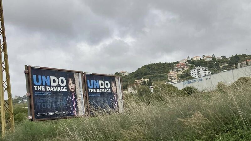Billboards calling on the international community to 'undo the damage'. Photograph: Hannah McCarthy
