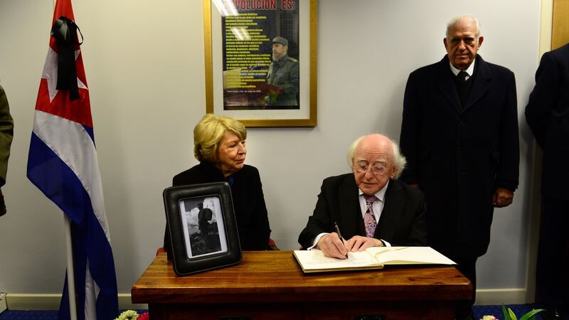 President Michael D Higgins with his wife Sabina and Cuban Ambassador Dr Hermes Herrera. Mr Higgins signed the book of condolence for former Cuban leader Fidel Castro at the Cuban Embassy in Dublin on Monday. Photograph: Dara MacDónaill/ The Irish Times