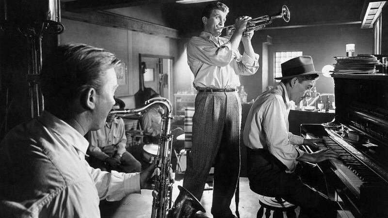 Hoagy Carmichael playing piano and Kirk Douglas playing trumpet in a scene from the 1950 film Young Man with a Horn, directed by Michael Curtiz